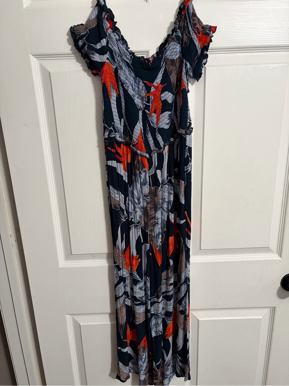 Flowy navy blue Floral Jumpsuit with Orange Accents